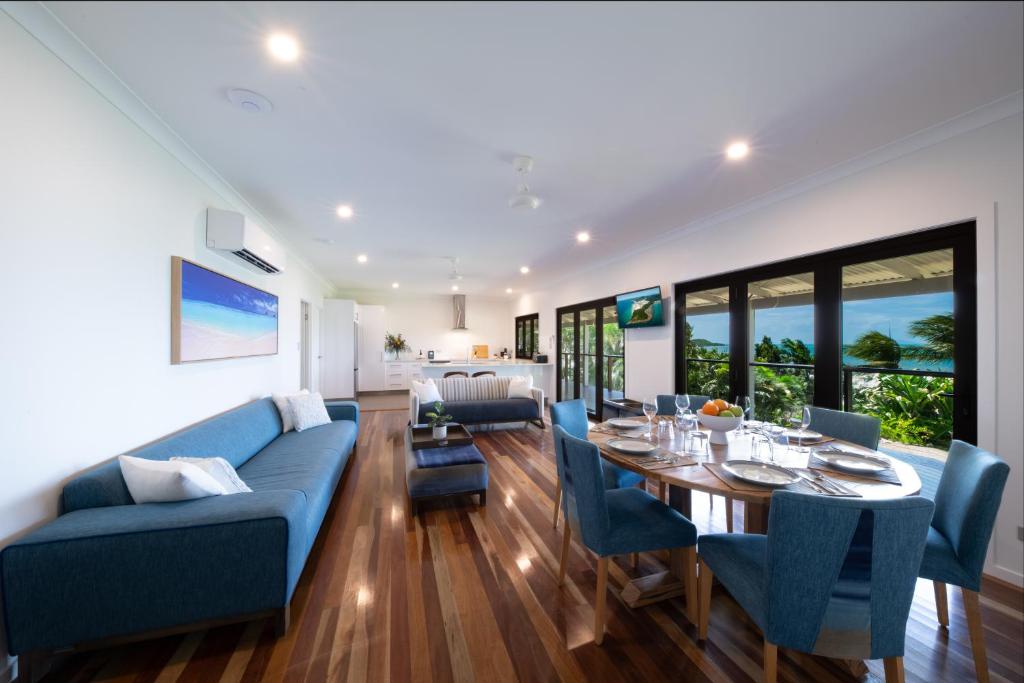 Spacious living area at Freedom Shores Resort with modern furnishings and dining setup.